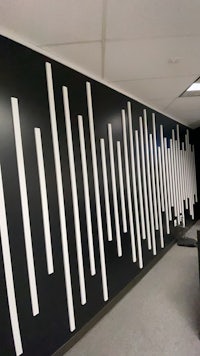 a black and white wall with white lines on it